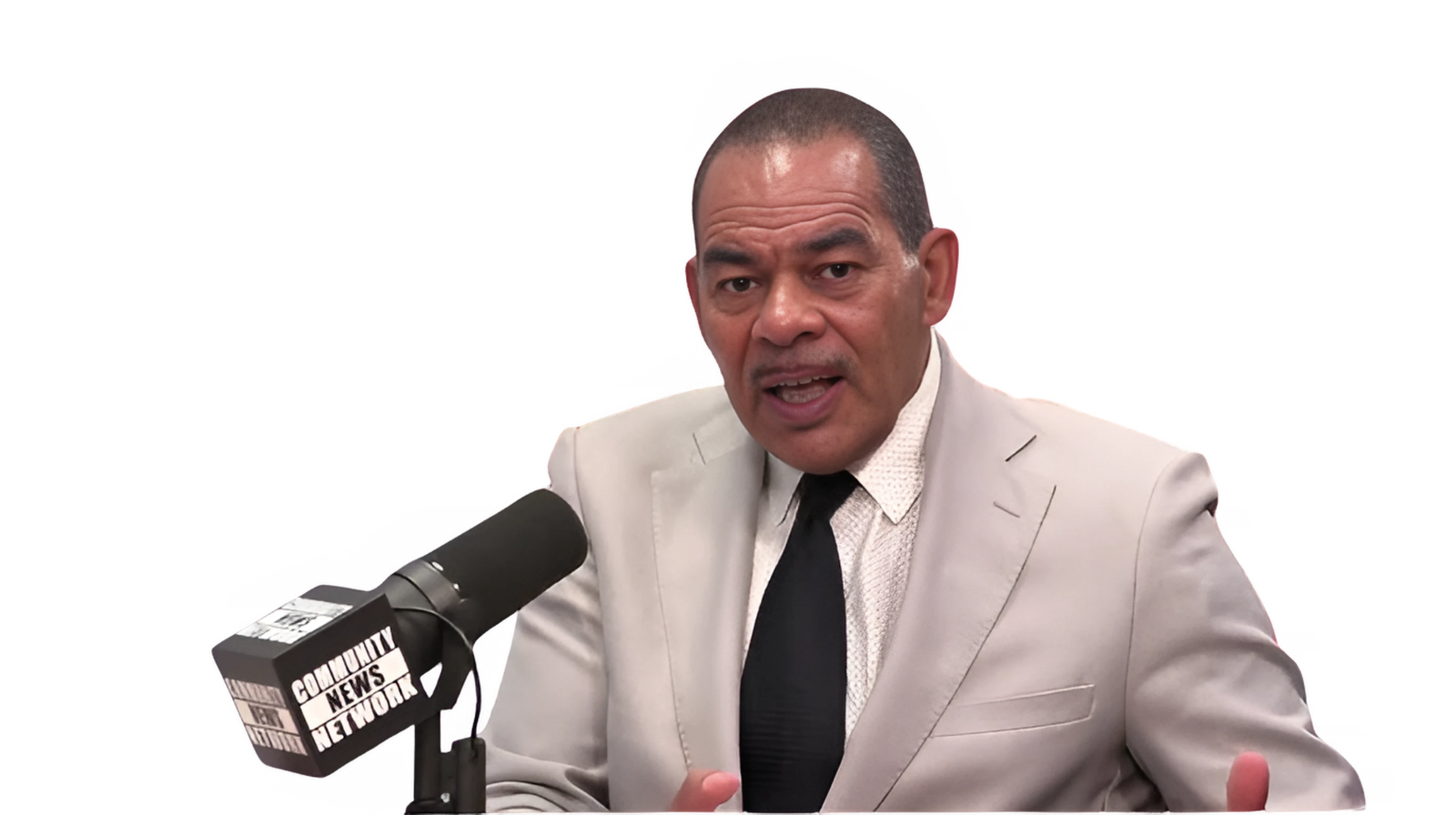 Miami Community Views A man sitting on a couch is being filmed by a director