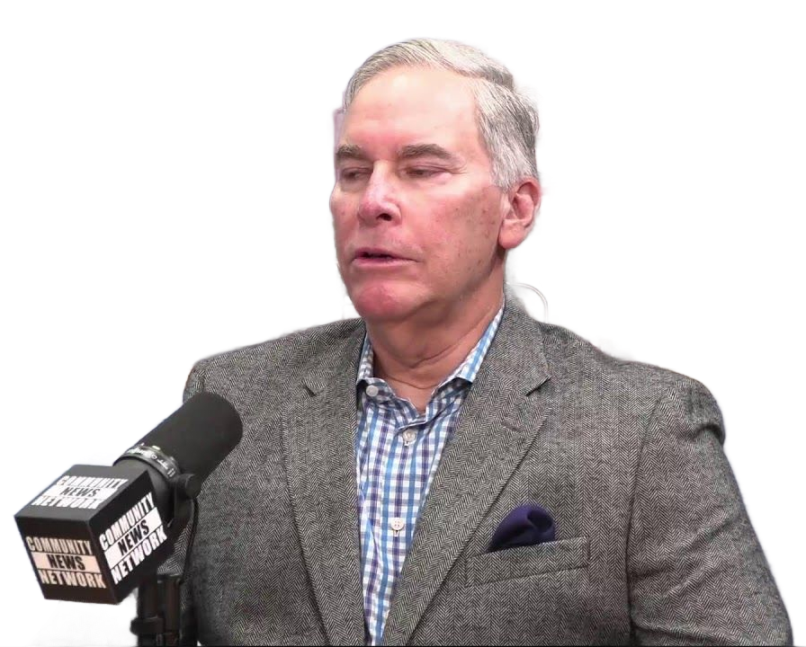 Miami Community Views A man sitting on a couch is being filmed by a director