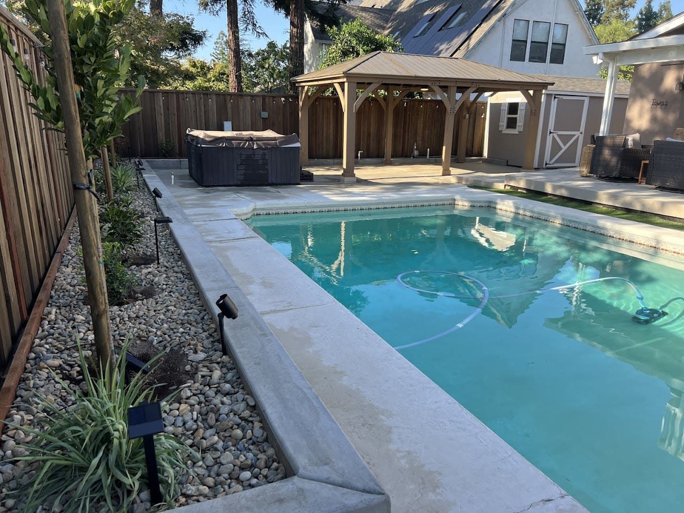 Professional poolside landscape design by Drago Landscaping in Stockton.