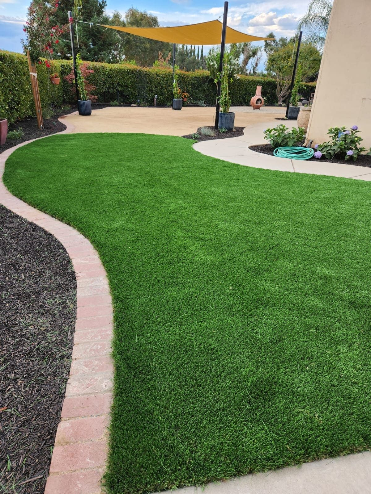 Artificial turf installation by Stockton landscaping team.