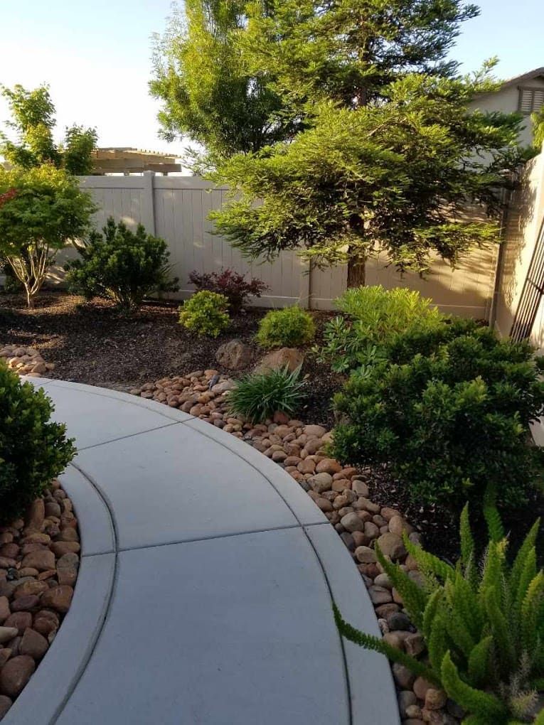 Landscape design with concrete path and turf installation in Stockton.