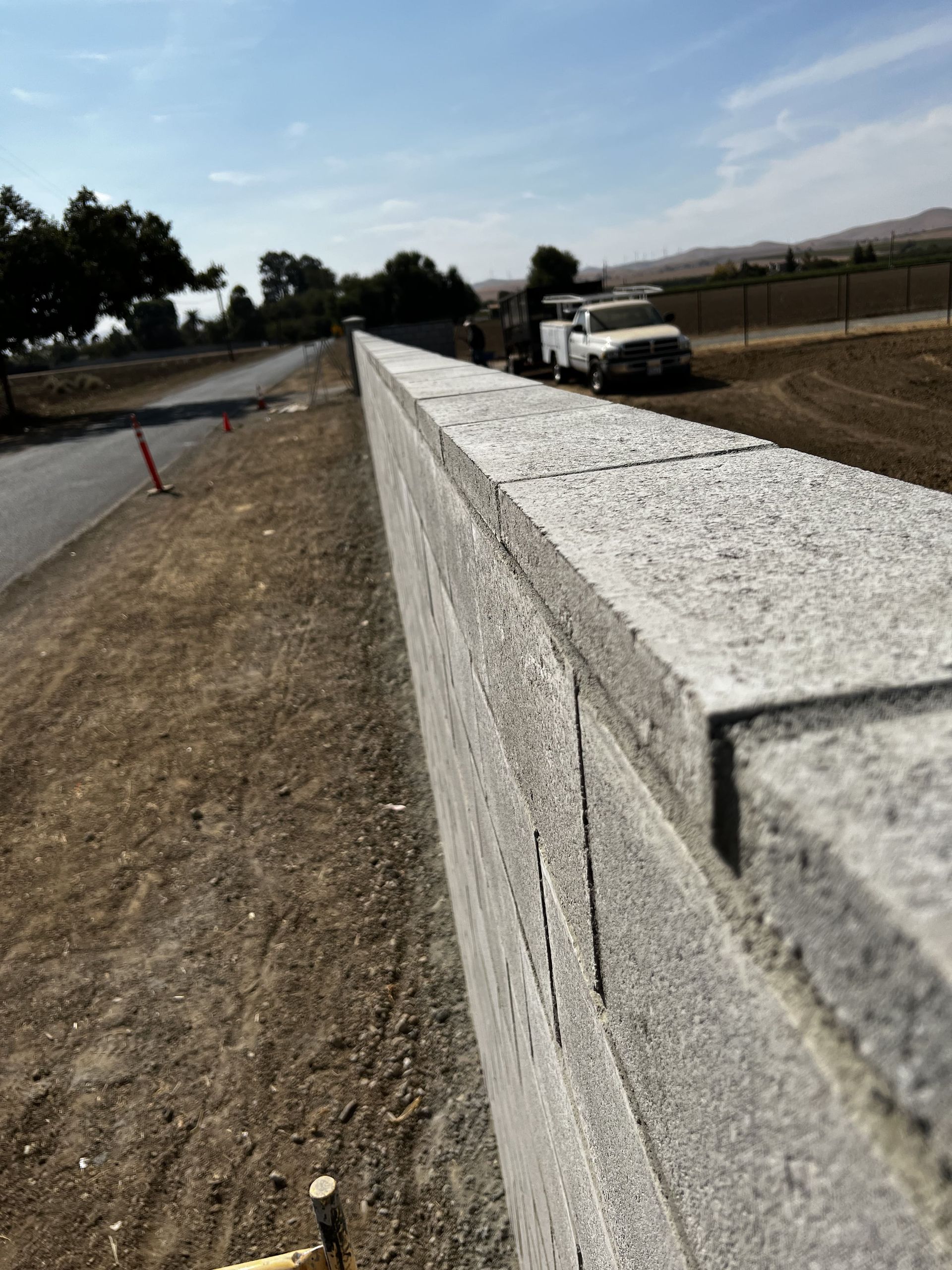 Close-up of retaining wall construction by Stockton landscapers.