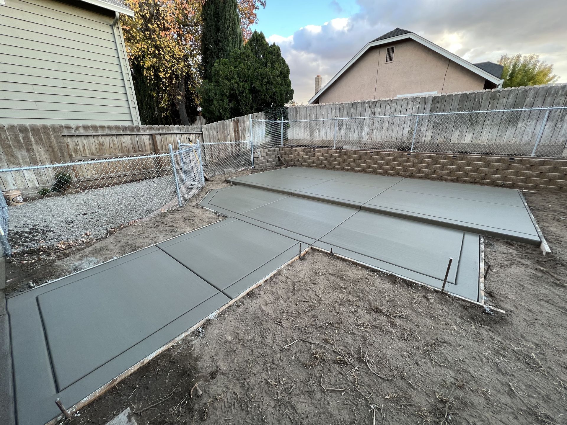 Concrete patio pathway in Stockton residential backyard connecting outdoor living areas