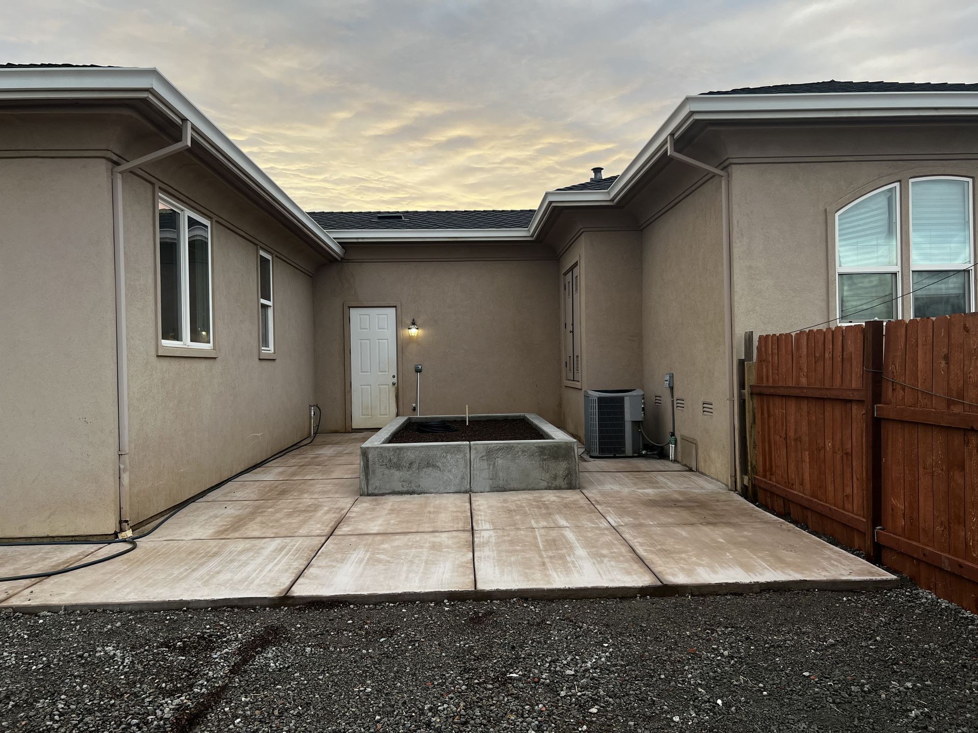 Backyard landscaping with concrete dirt planter in Stockton CA.