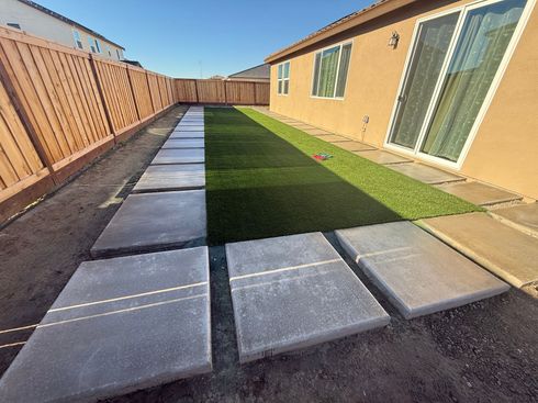 Landscape design with concrete path and turf installation in Stockton.