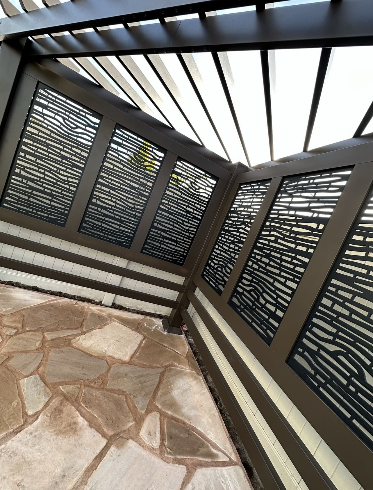 Modern shade structure in Stockton backyard with seating and landscaping Stockton CA