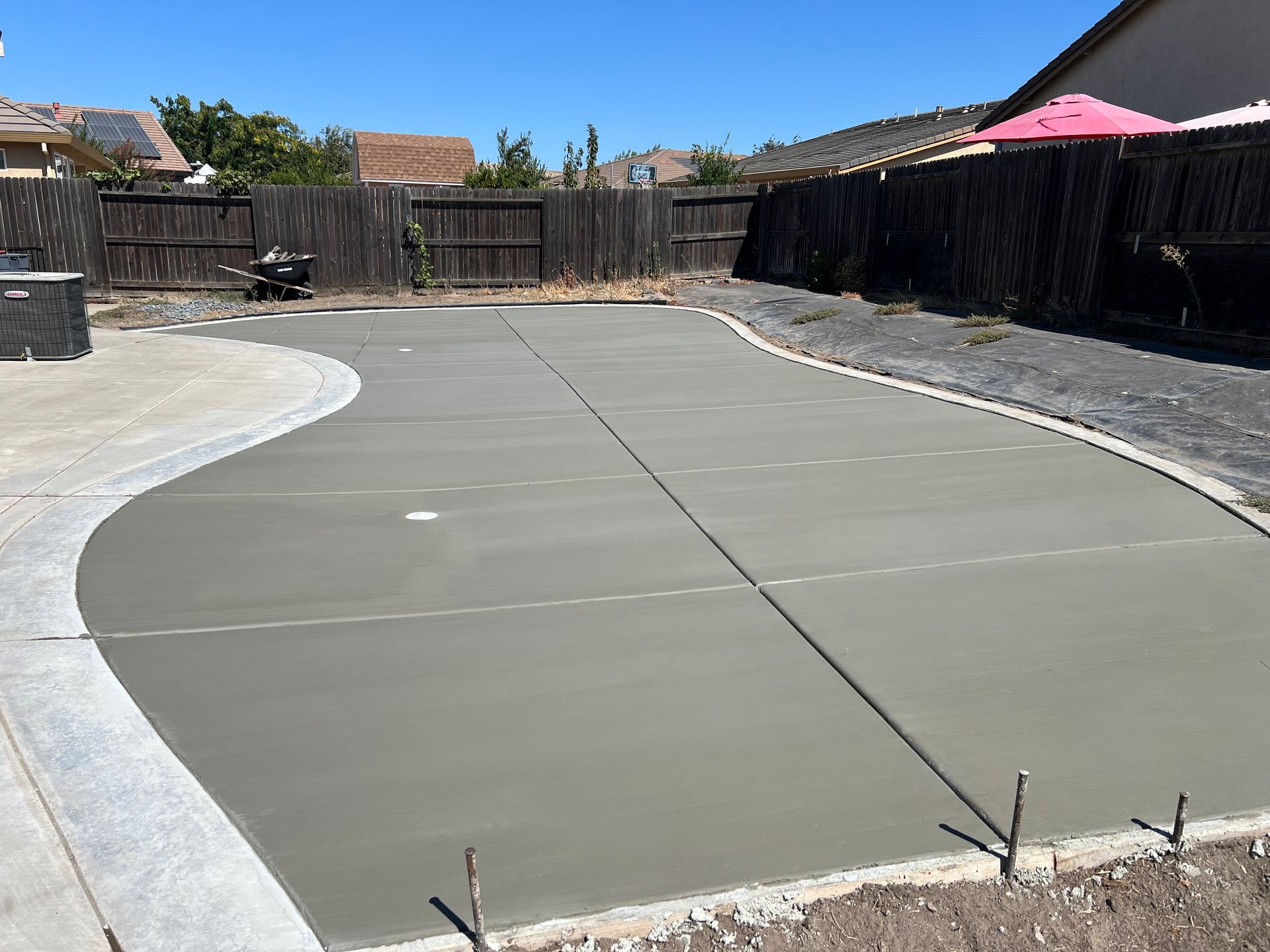 Smooth concrete patio designed by Drago Landscaping in Stockton.