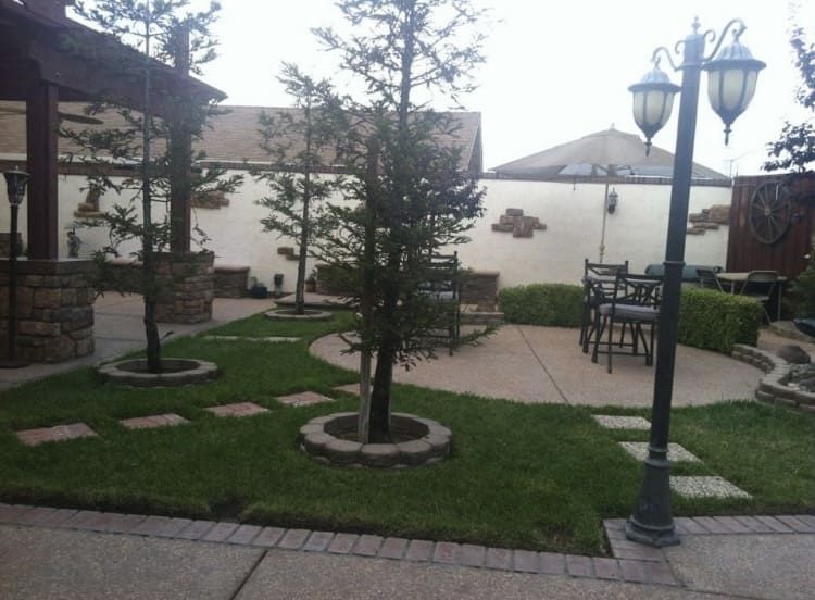 Patio landscape project with concrete seating area in Stockton.
