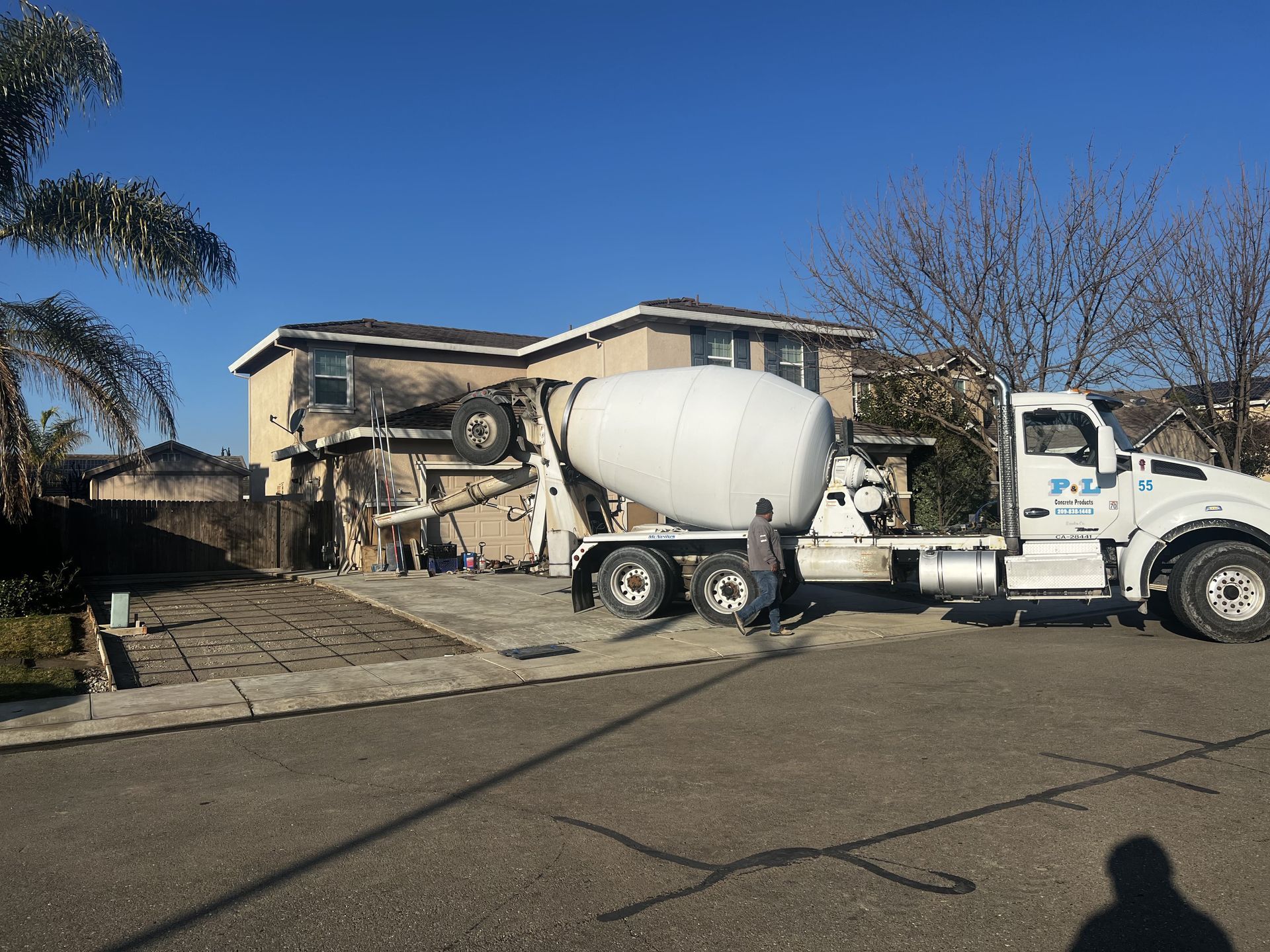 Concrete delivery truck on site in Stockton before starting a residential driveway installation