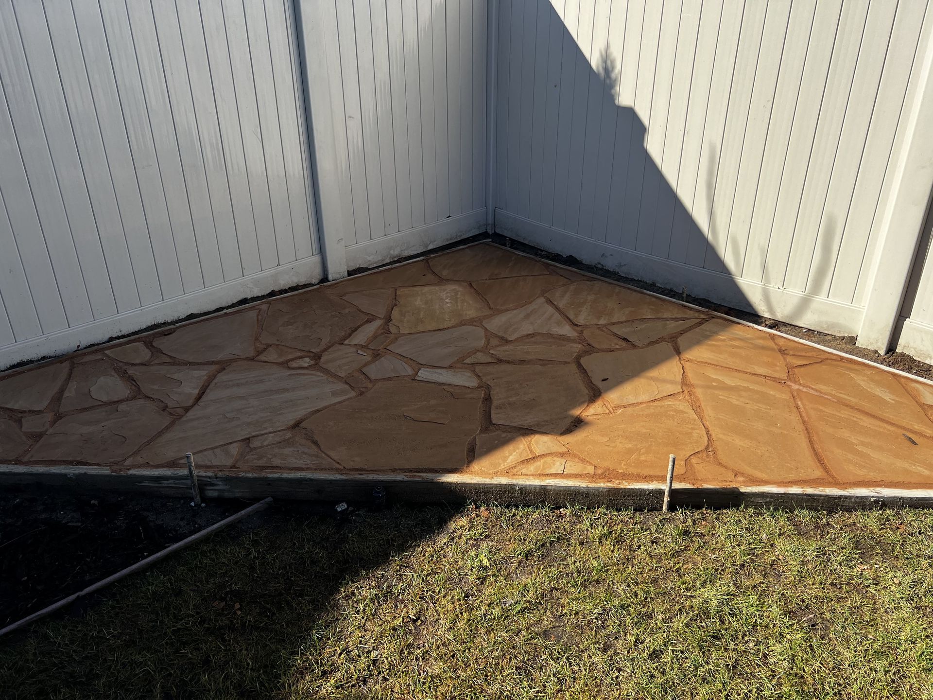 Stamped concrete on patio corner in residential Stockton home.