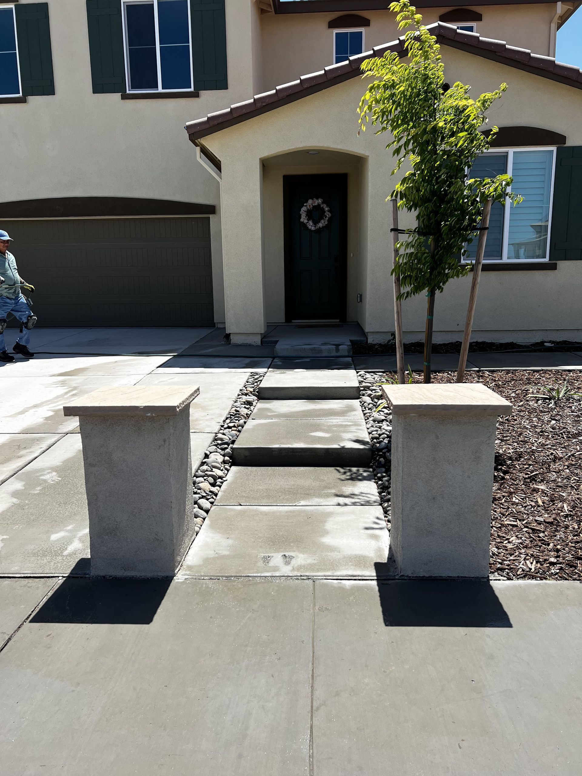Residential walkway in Stockton with concrete curing to prevent cracks and ensure long-term durability
