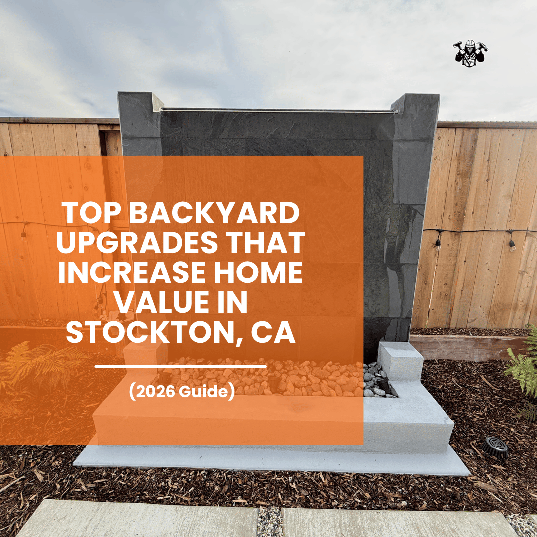 Water cascade feature with natural rocks and mulch landscaping in a backyard in Stockton, CA