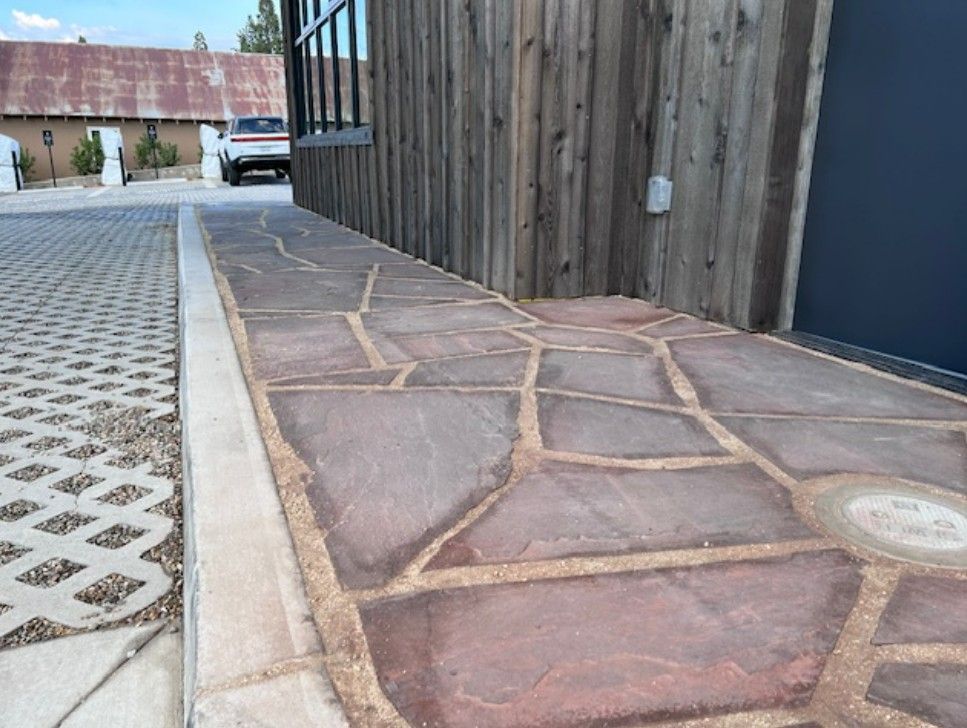 Flagstone being placed as part of landscape upgrade.