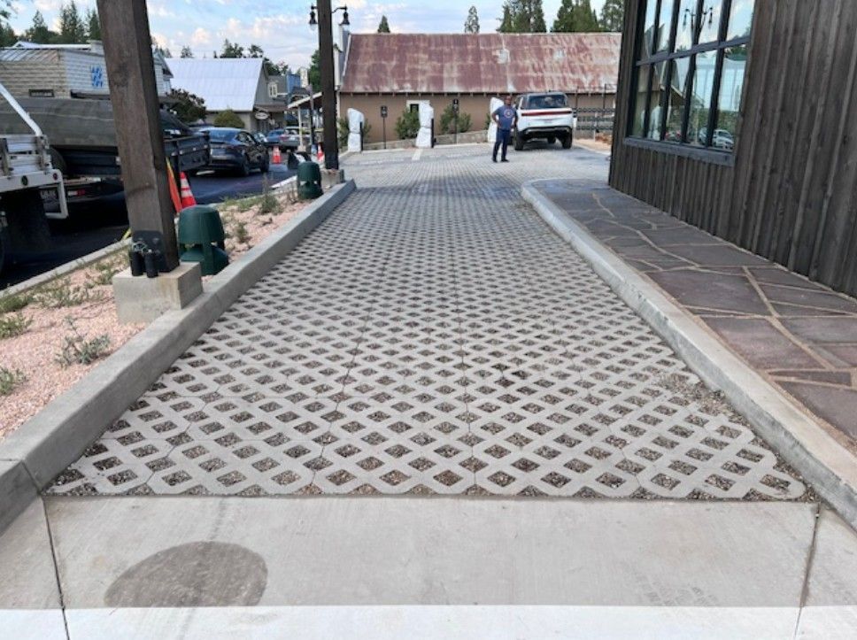 Commercial landscaping with pavers and gravel.