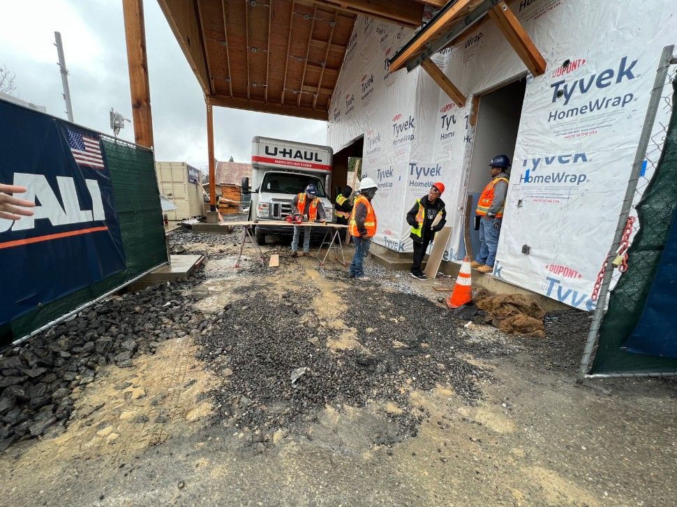 Unfinished entry space before paver and concrete upgrades.