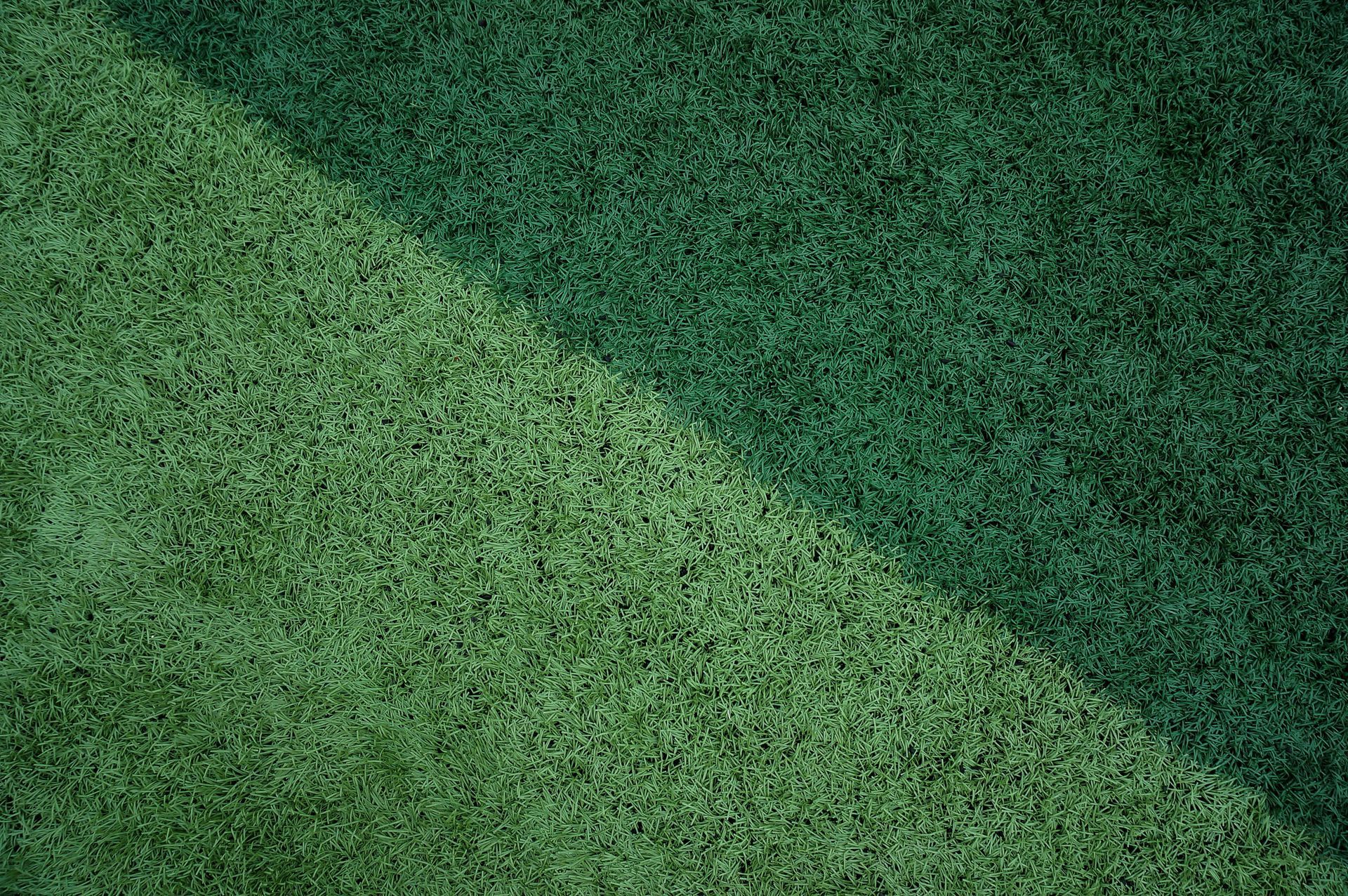 Before and after artificial turf maintenance in Stockton CA showing cleaned and refreshed lawn