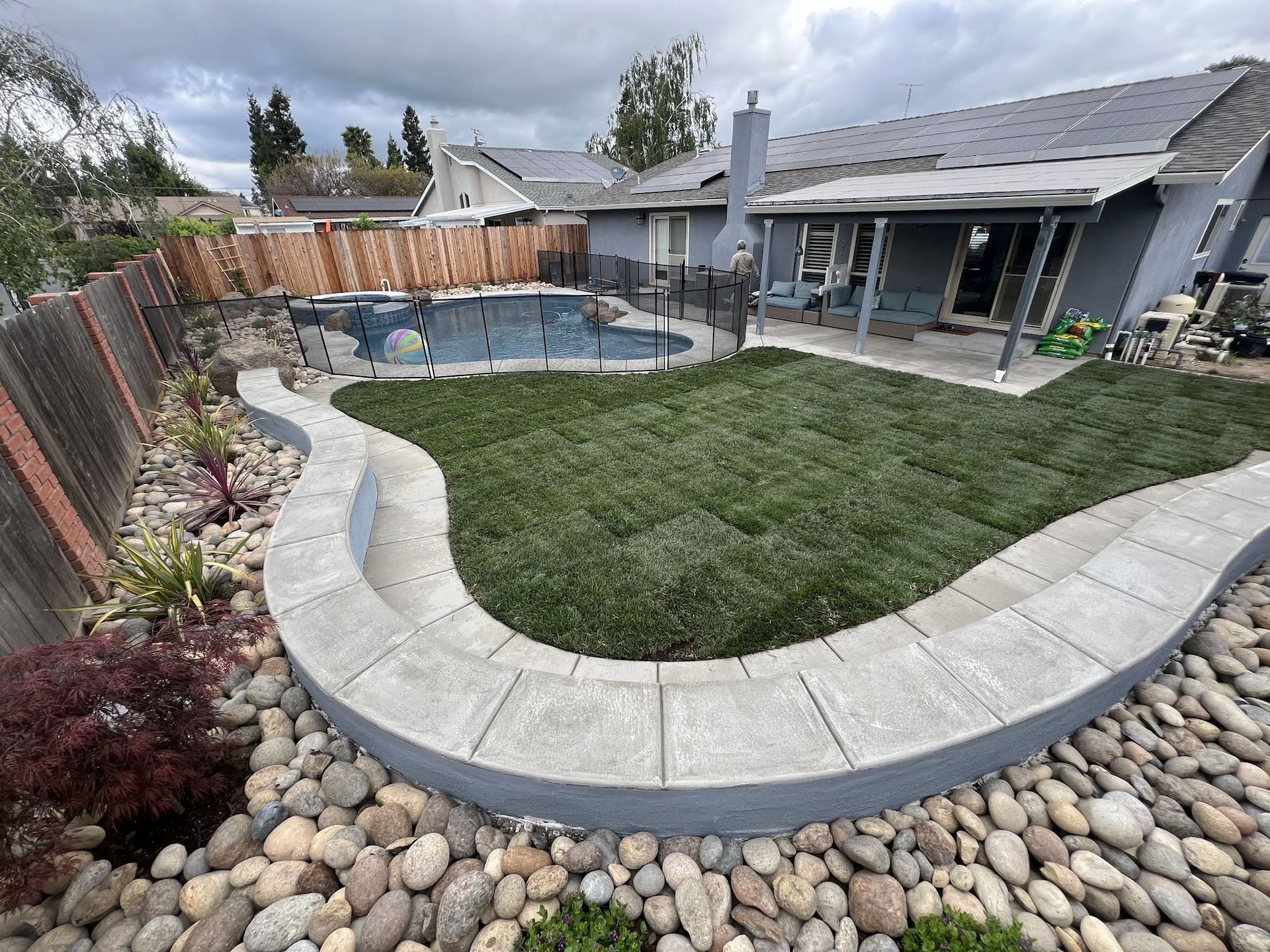 Modern pool patio design in Stockton with durable pavers and stylish hardscaping.