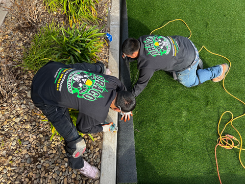 Drago Landscaping team installing artificial turf in Stockton.
