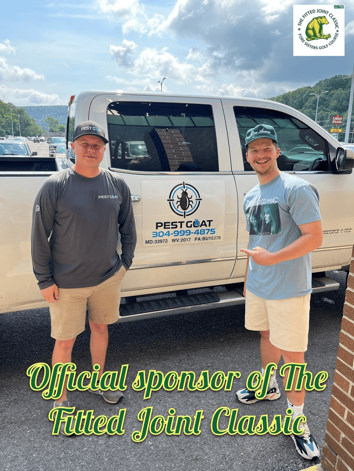 Two men stand by a truck with 