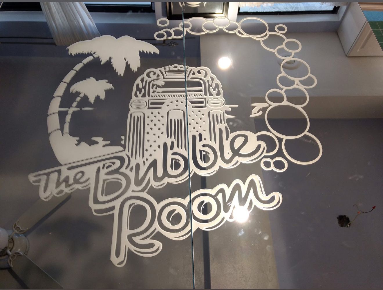 White logo on glass door: 