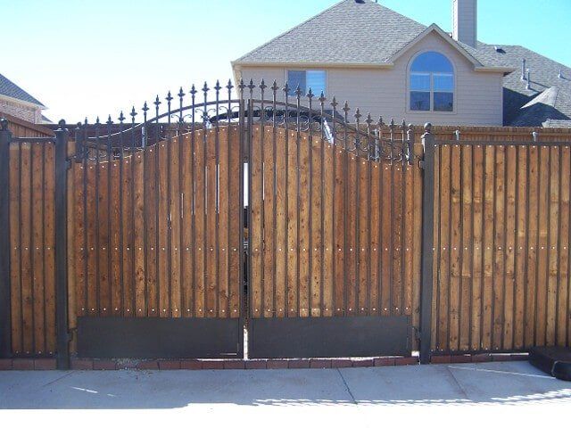 Wooden gate with reinforced steel - Custom gate fabrications in Plano, TX