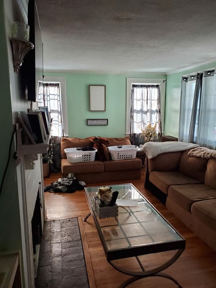 Before photo of the living room that was to be updated by New England Painting and Contracting