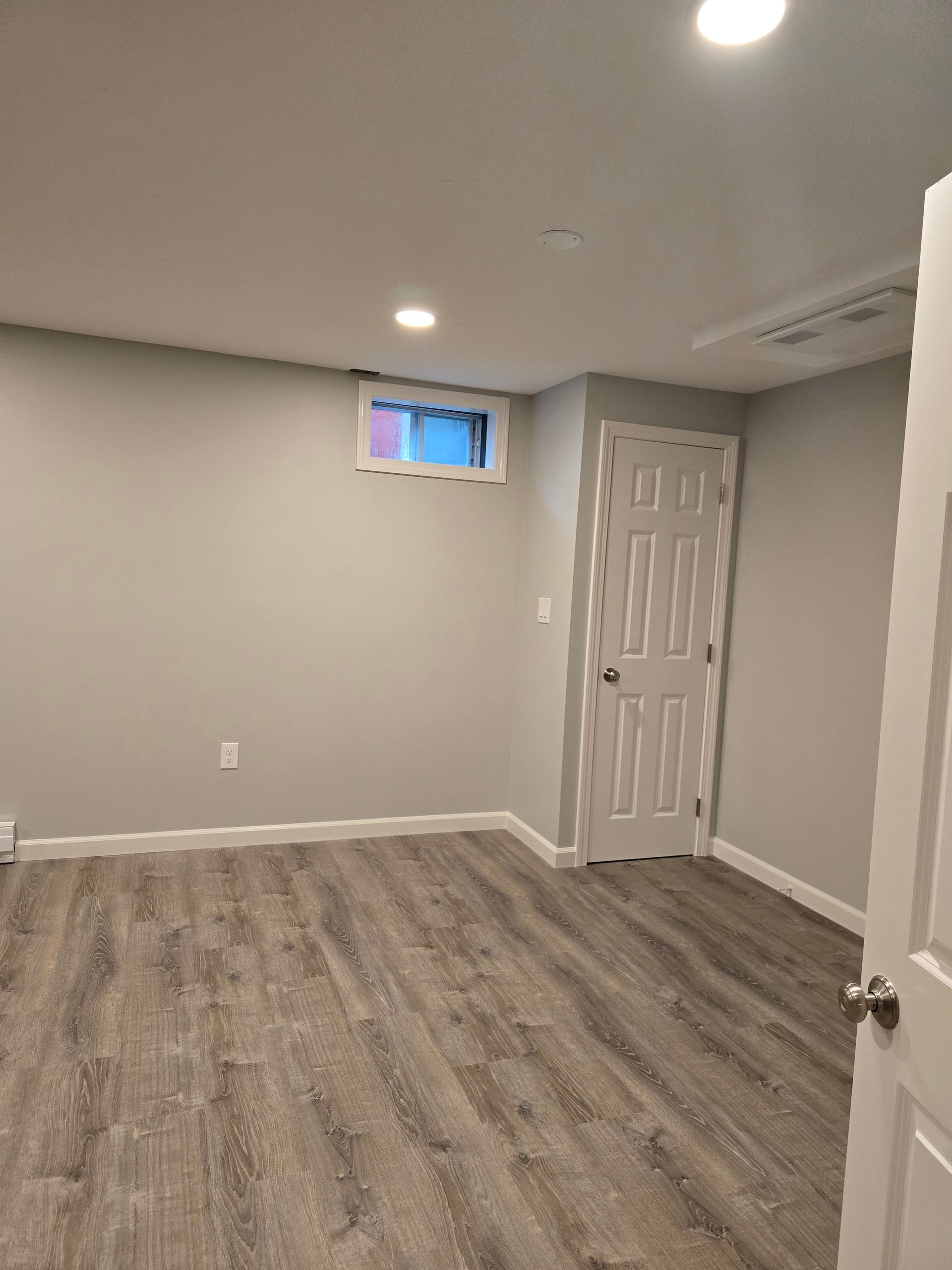 Basement Remodeling Project in Melrose, MA, by New England Painting and Contracting