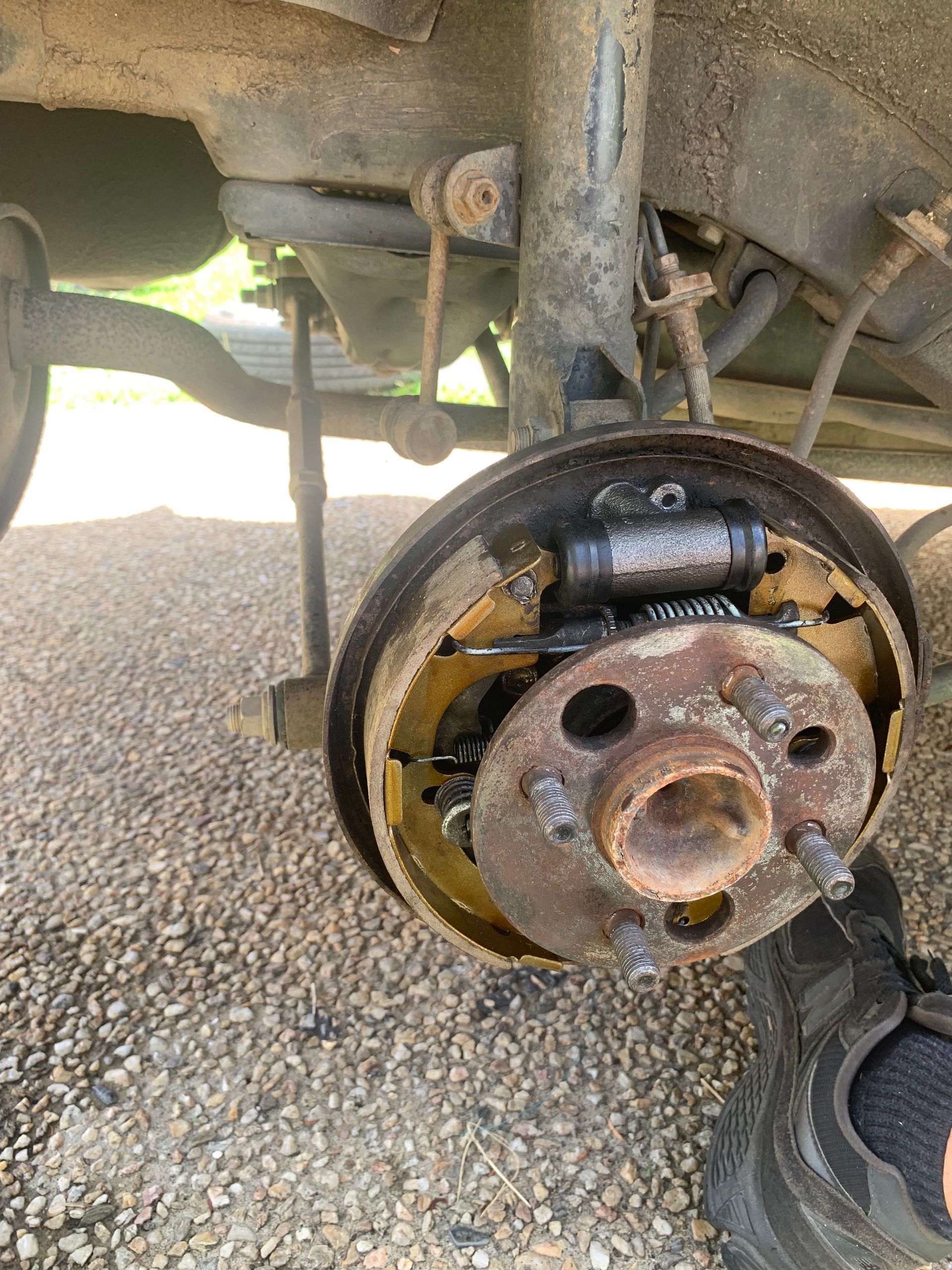 Rear Car Drum Brake Assembly With Brake Shoes Exposed. Rusty Metal Components — Calvin's Mobile Mechanics In Elanora, QLD