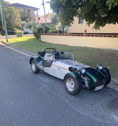 Green and silver sports car parked on a suburban street — Calvin's Mobile Mechanics In Elanora, QLD