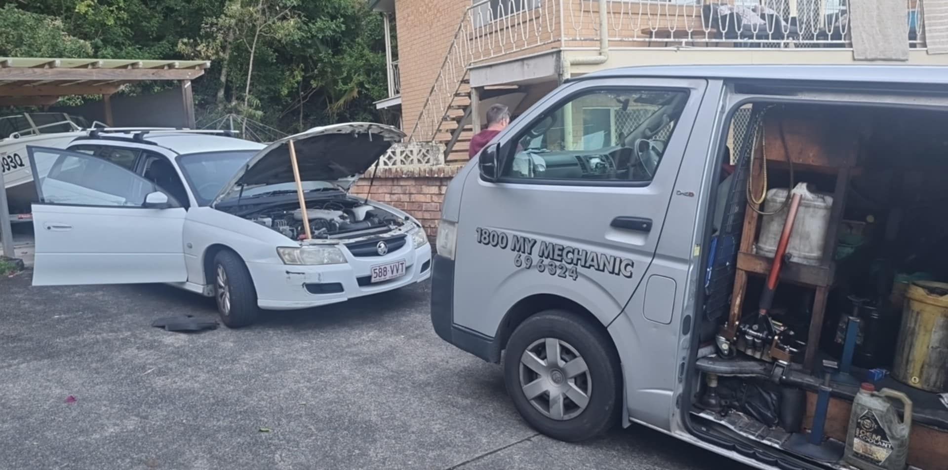A White Car With the Hood Open, Parked Near a Silver Service Van — Calvin's Mobile Mechanics In Elanora, QLD