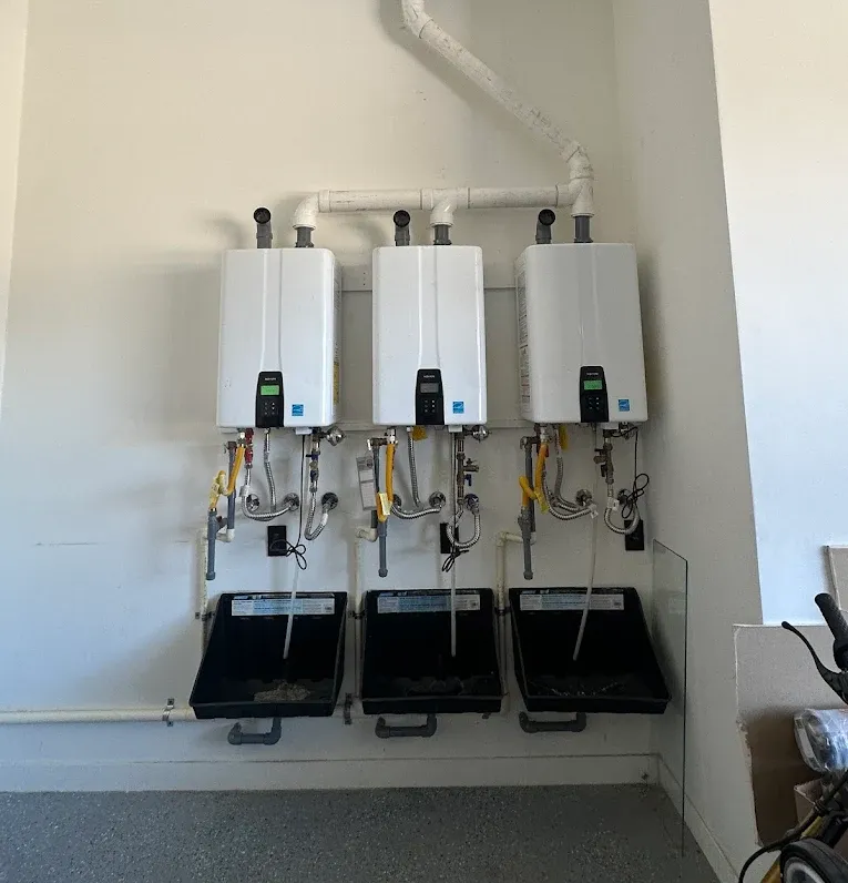 a man is standing in the back of a van holding a bucket