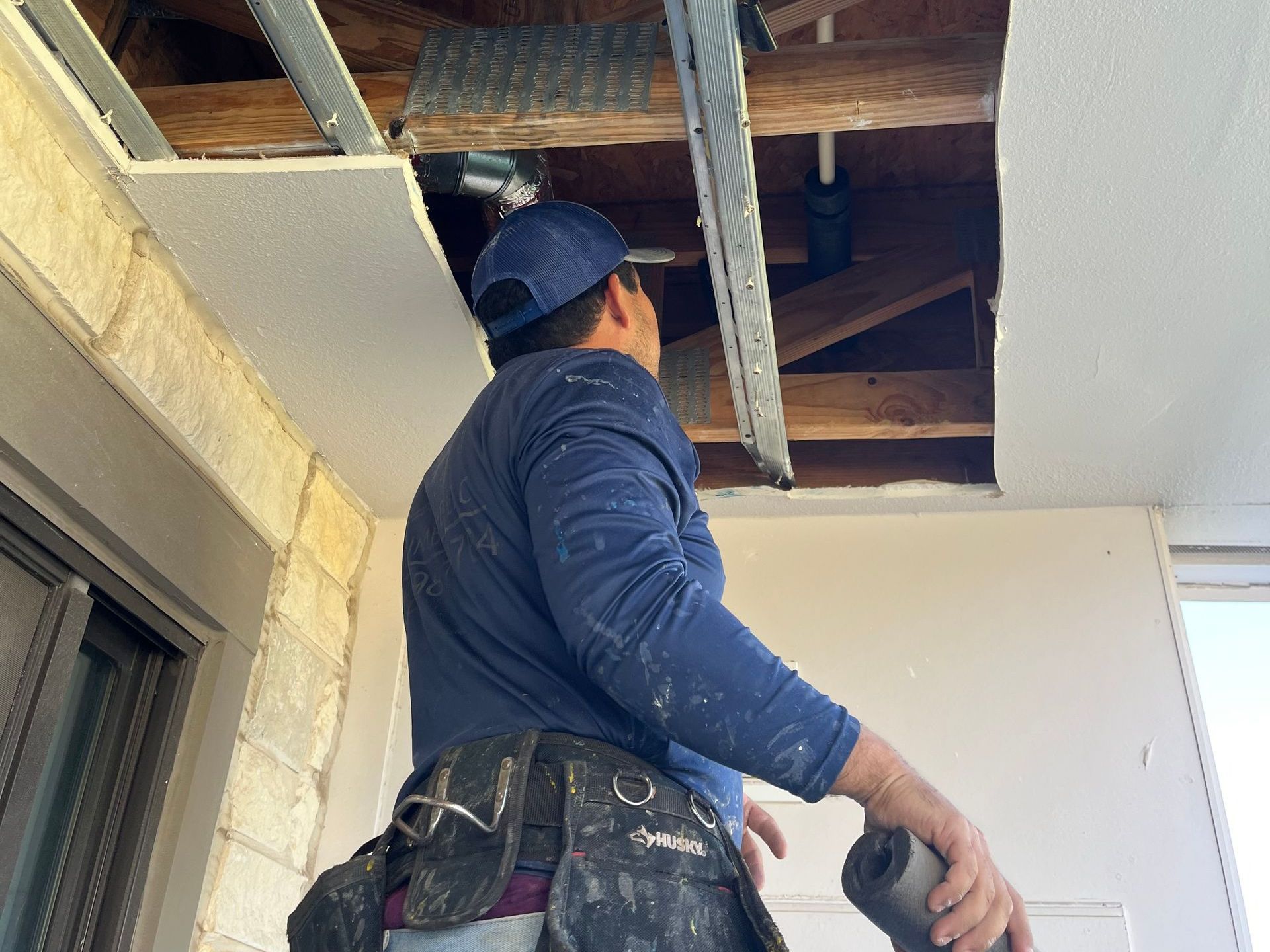 Plumber performing home plumbing maintenance in Coupland, TX, to prevent leaks and safety risks