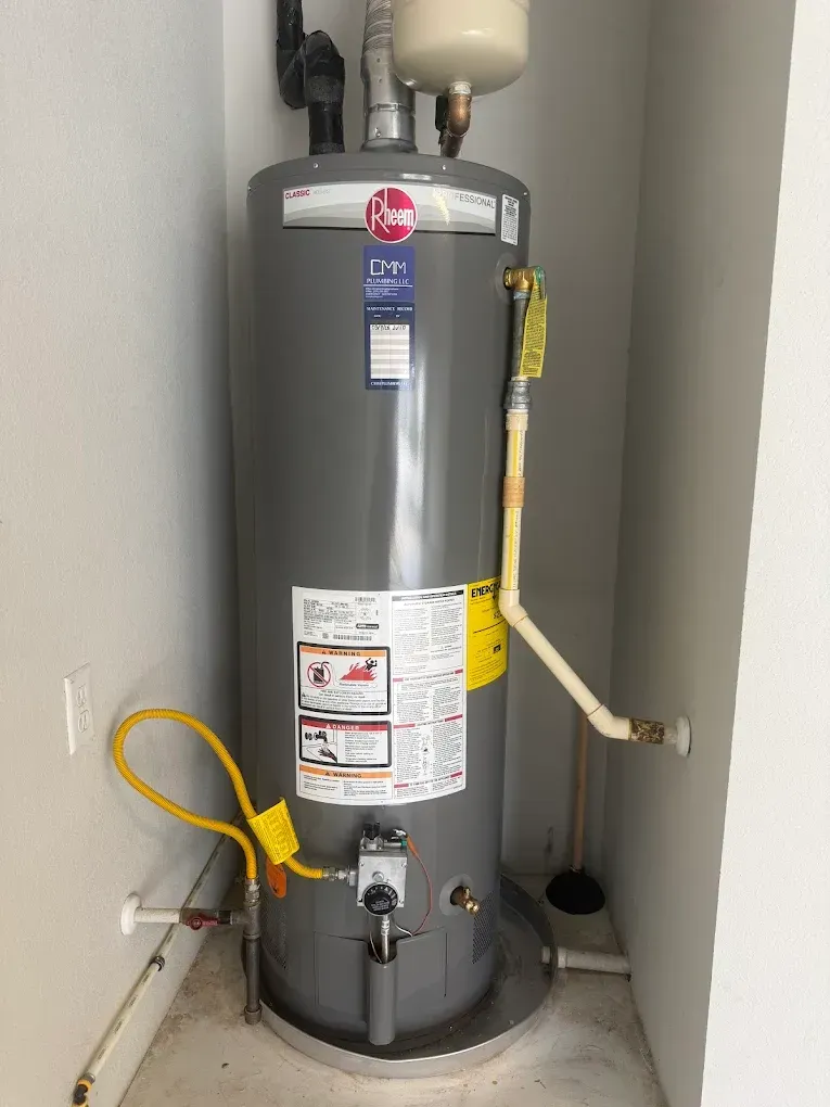 two men are looking at a box that says 50 gallons on it