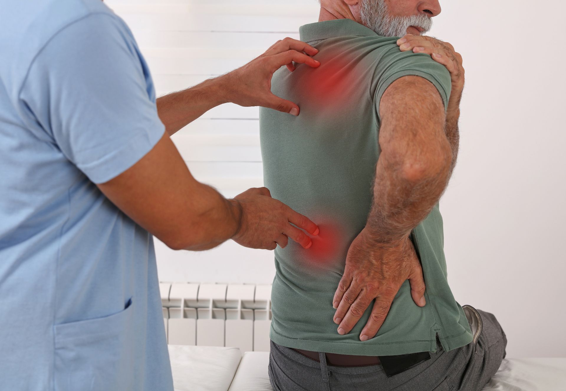 Doctor checks elderly man's back pain with red highlights showing spinal discomfort in clinic exam.