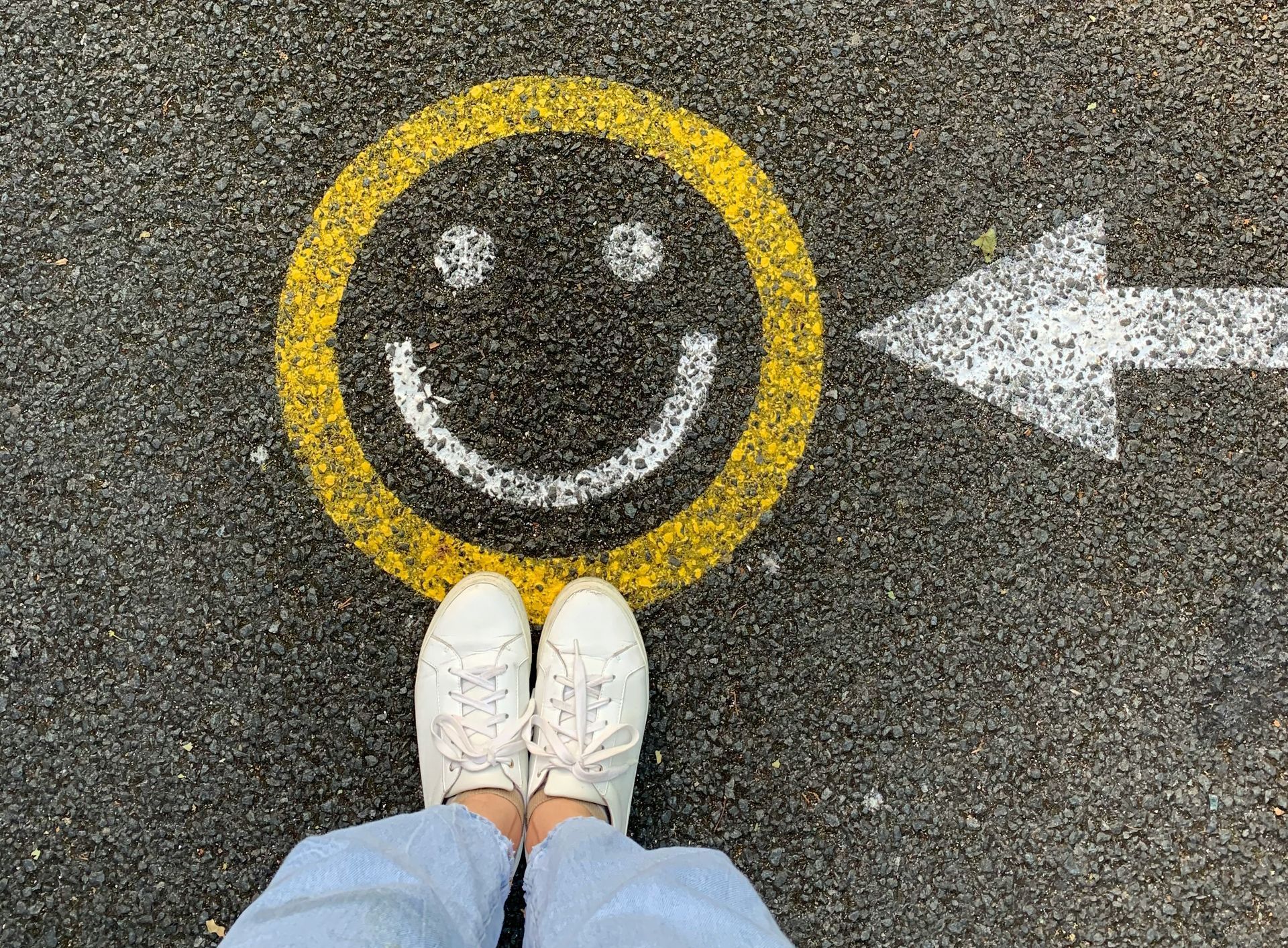 Person standing on a concrete road