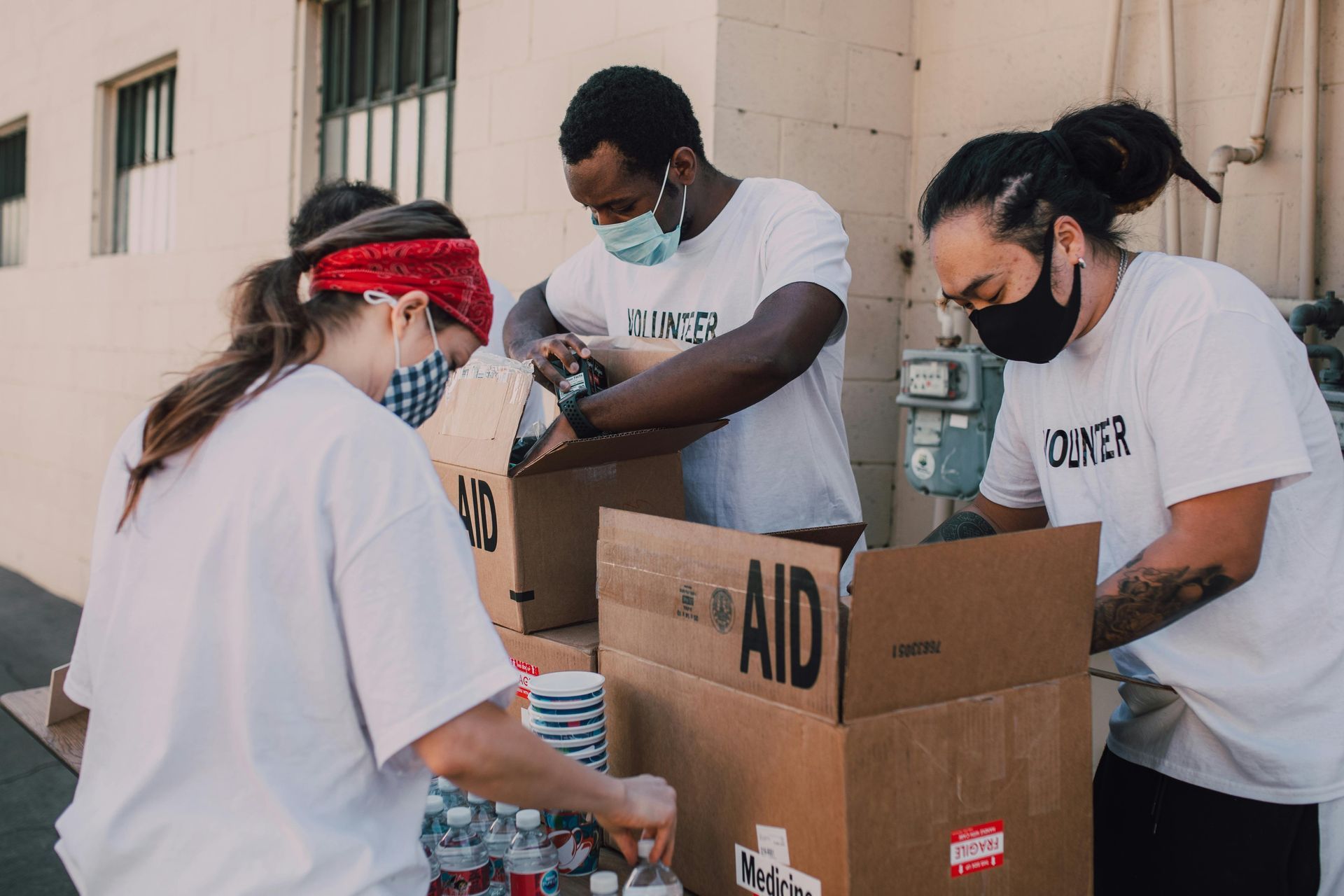Volunteers packing boxes labeled 