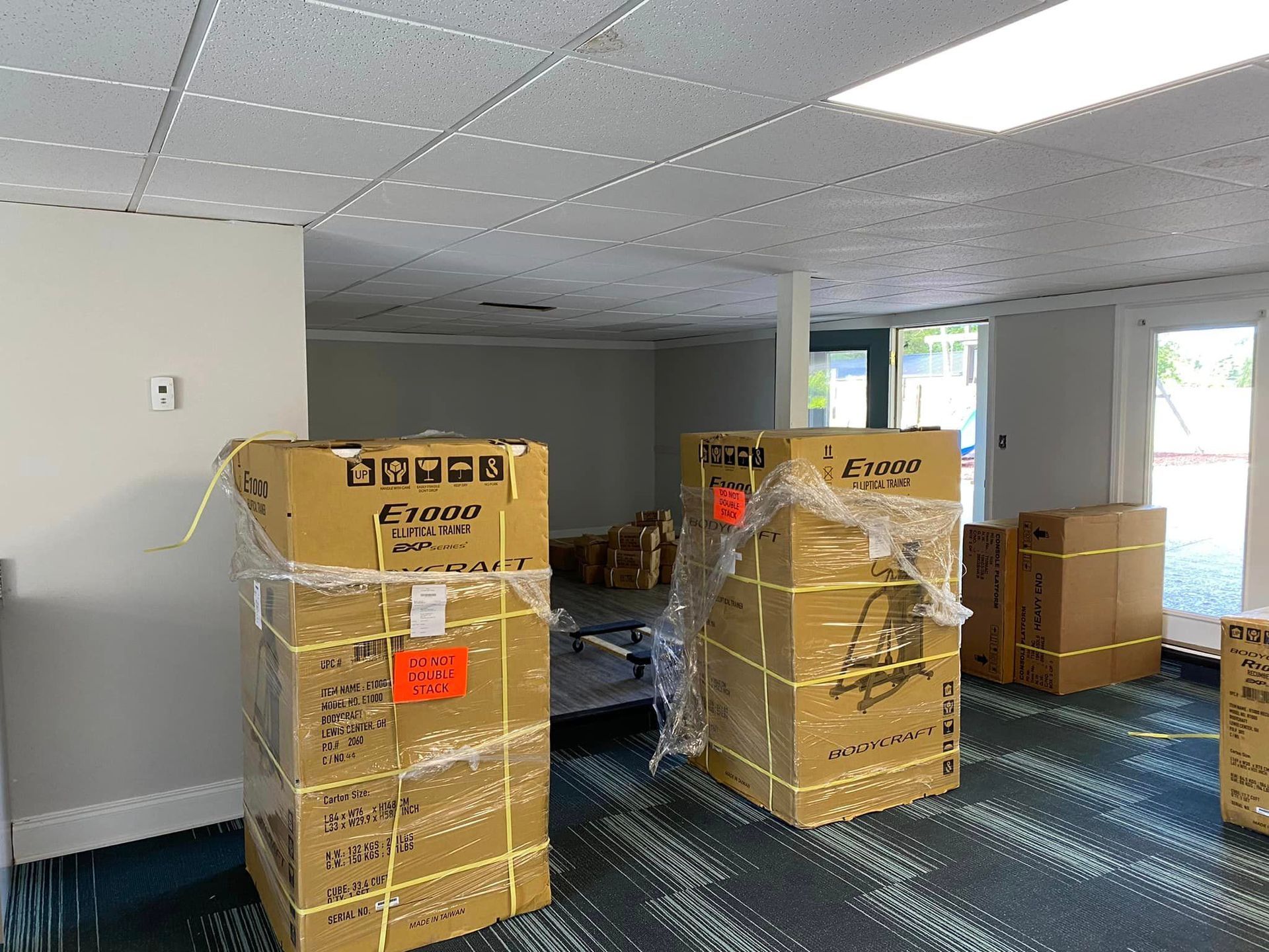 A room filled with lots of boxes wrapped in plastic.