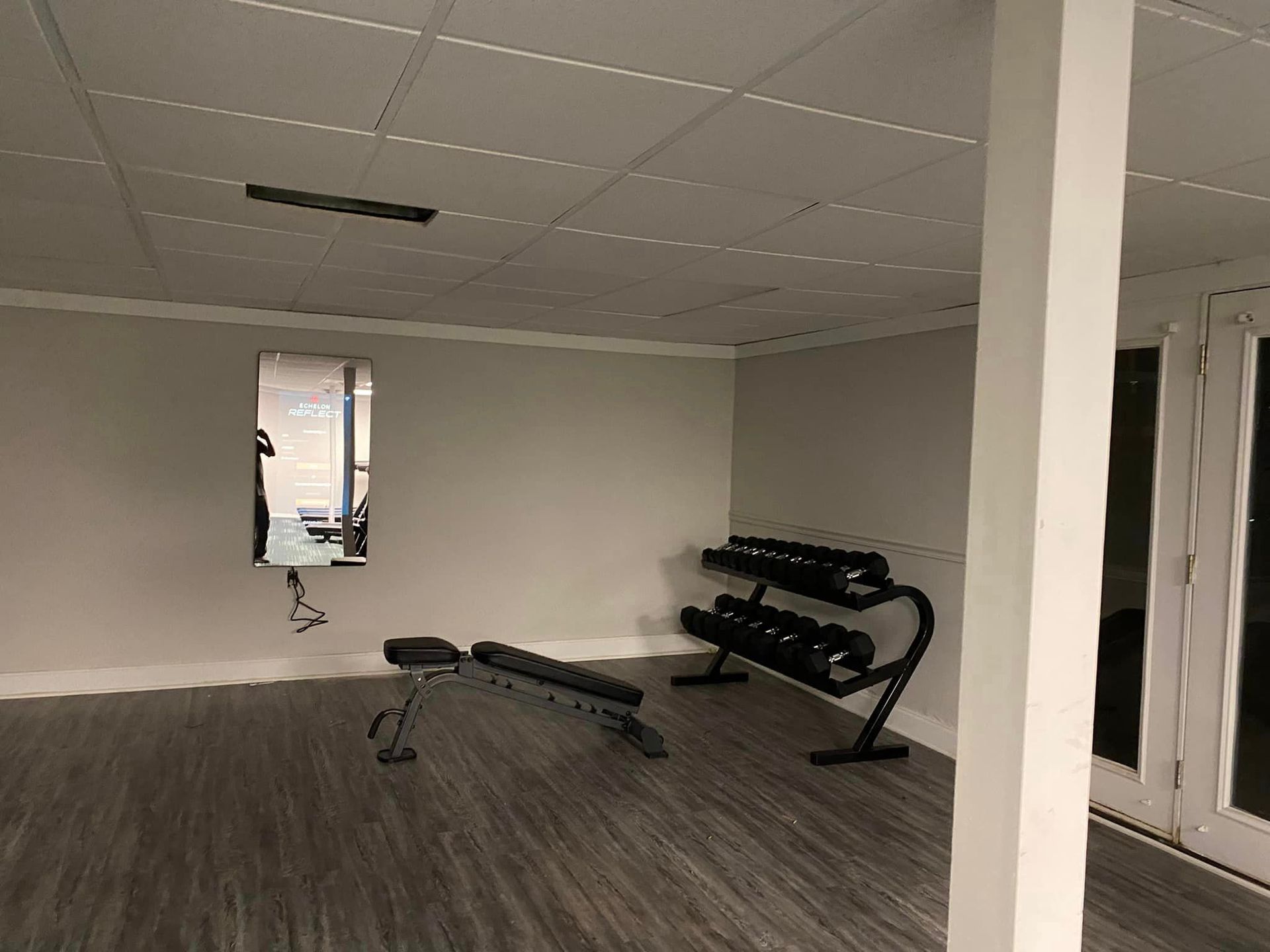 There is a bench in the middle of the room.