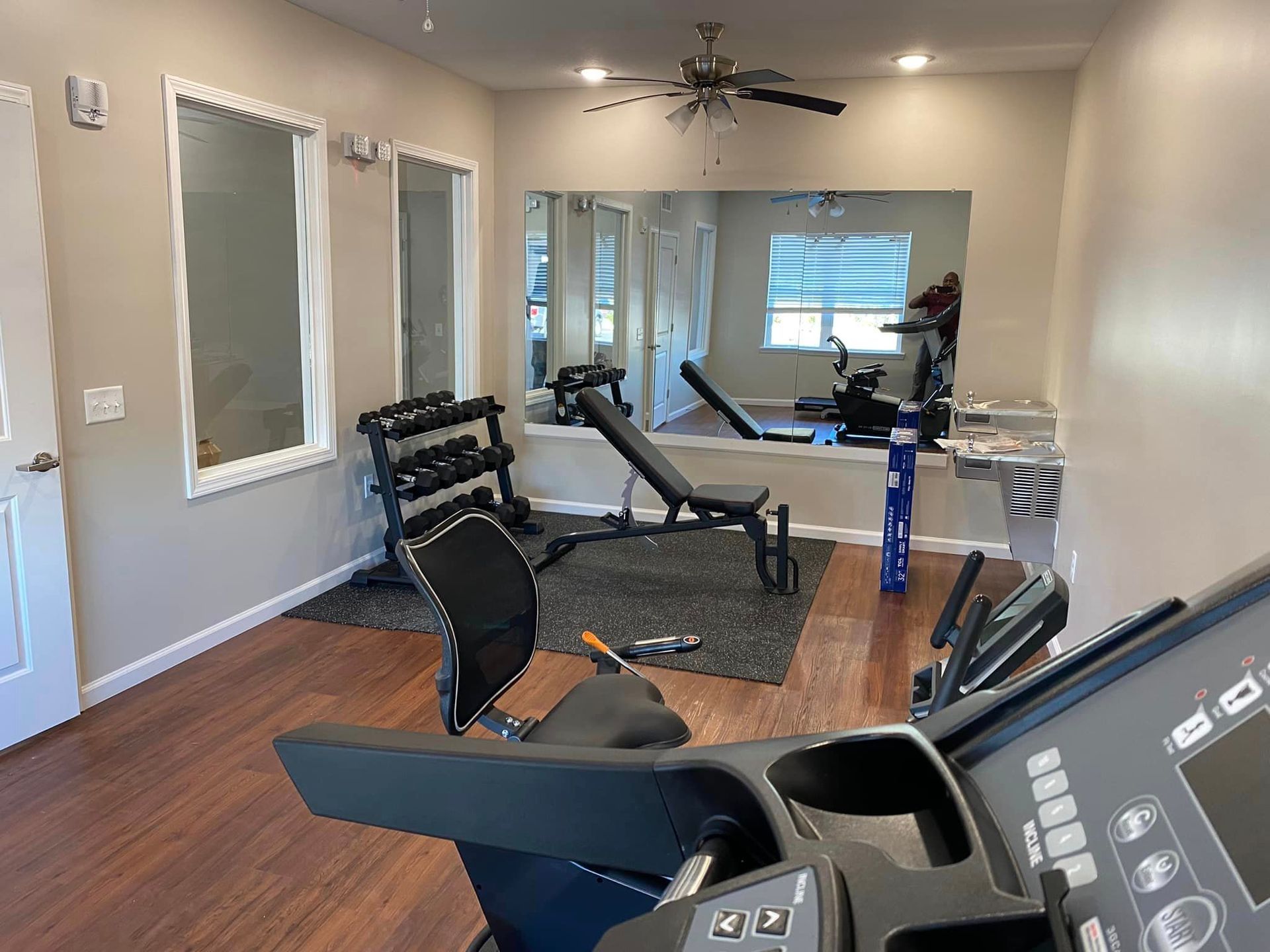 There is a treadmill in the middle of the room.