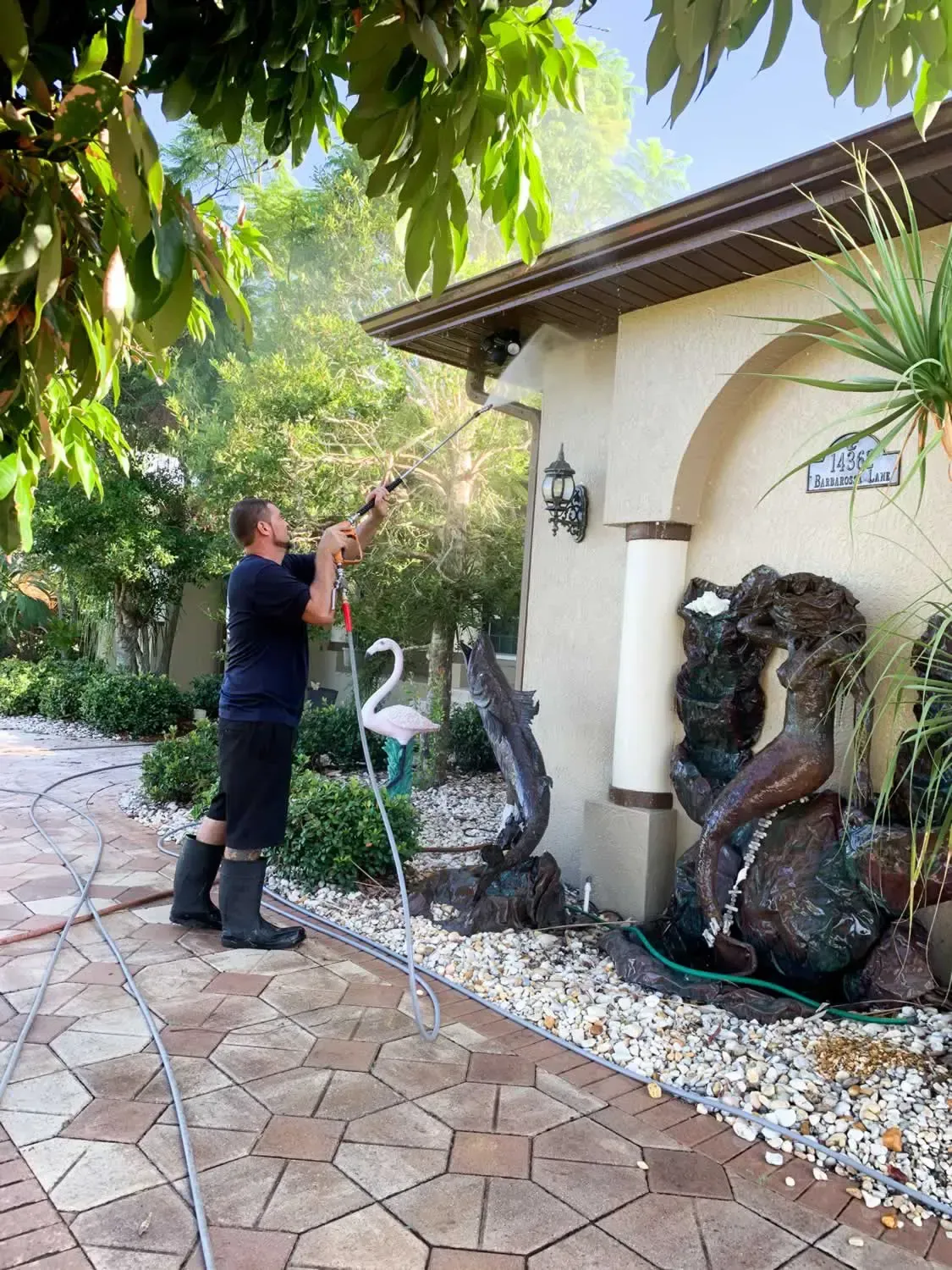Professional cleaner doing a pressure washing