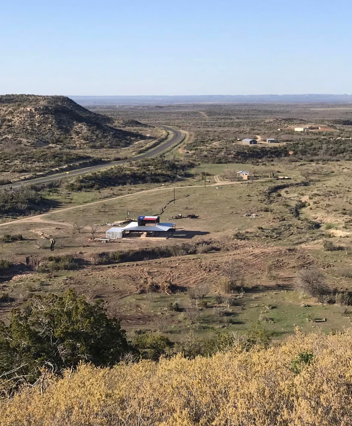 An aerial view of a farm in the middle of a desert.