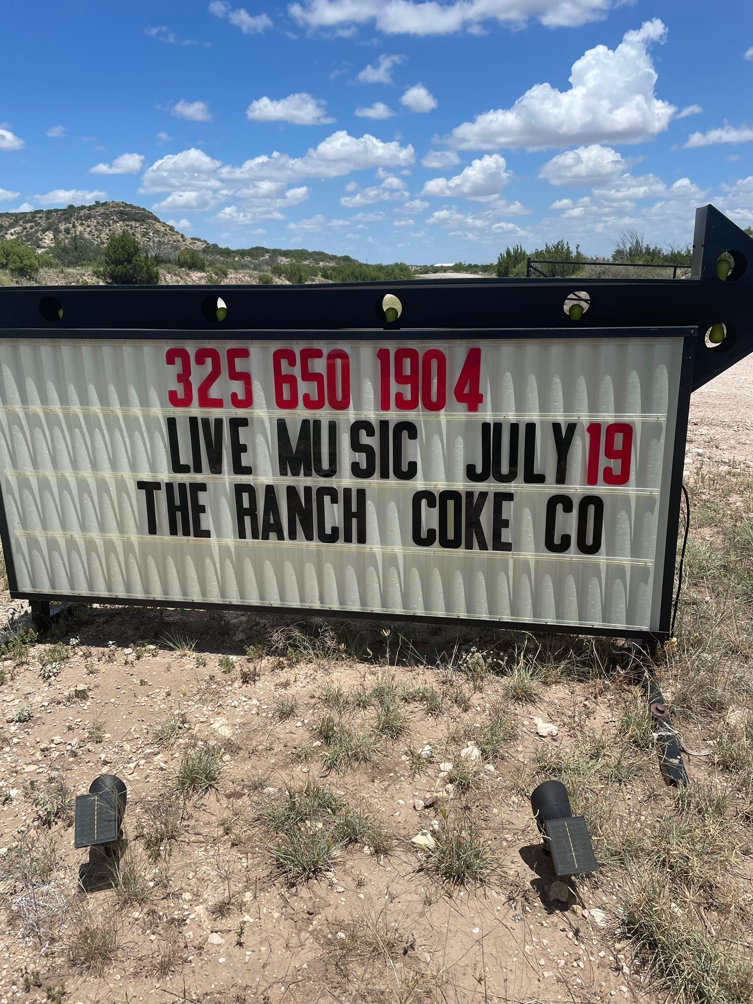 A sign that says live music july 19 at the ranch coke co.