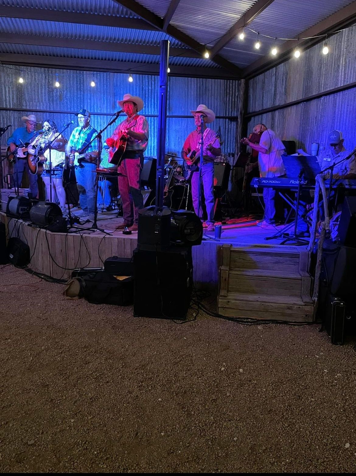 A group of men are playing instruments on a stage.