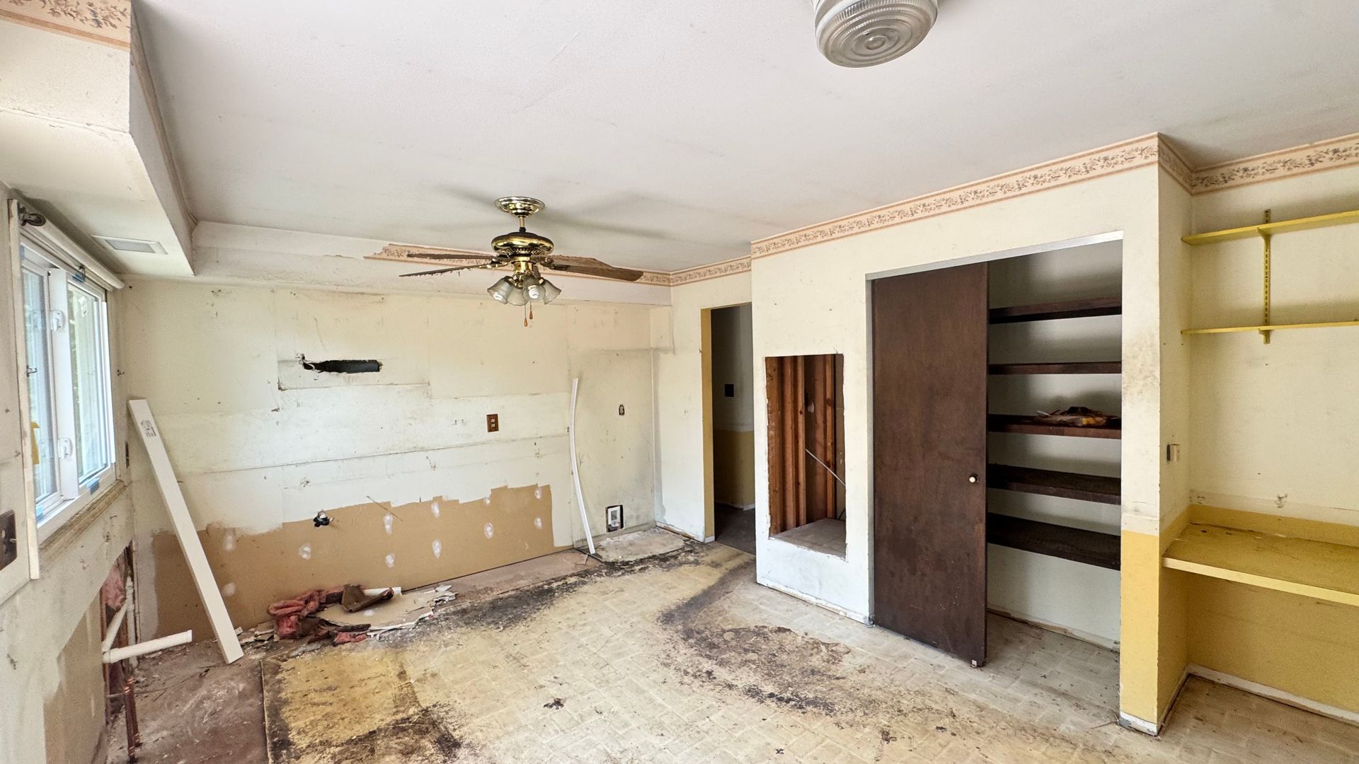 A backyard with a large swimming pool and a fire pit.