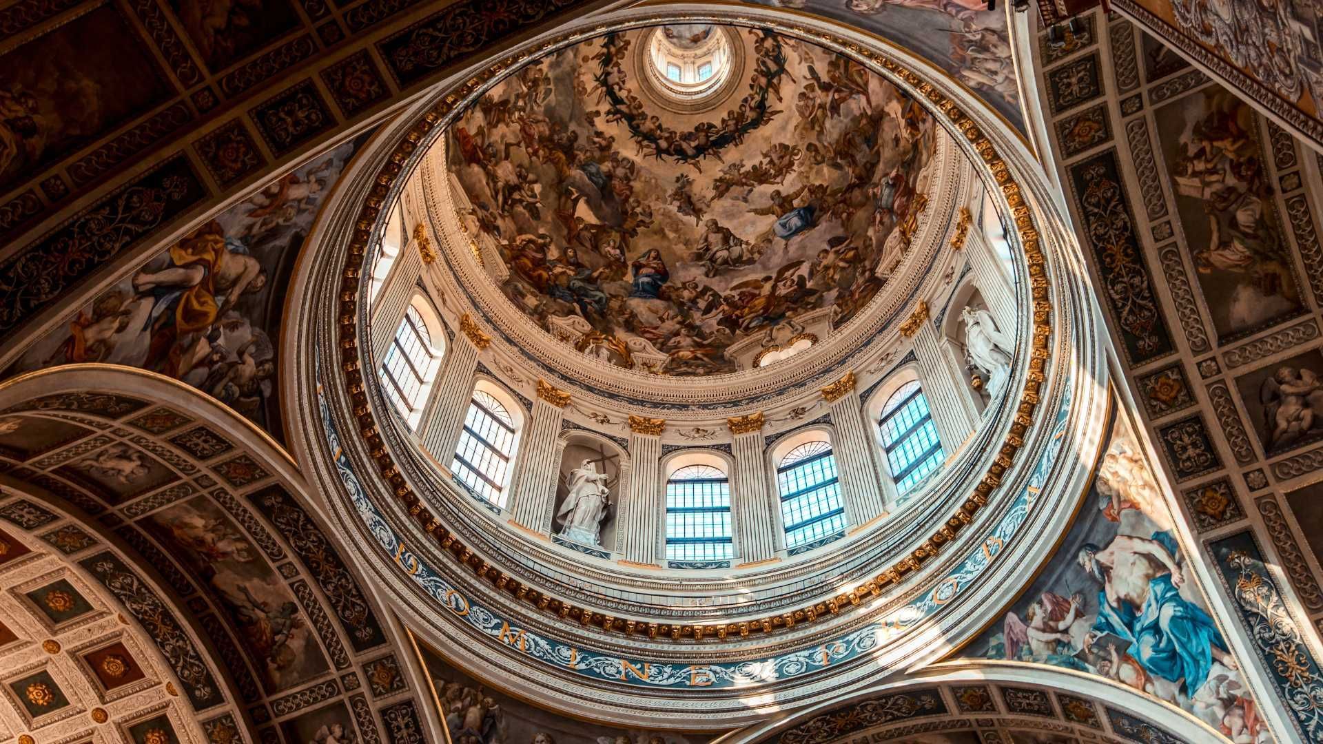 Looking up at the dome of a church.