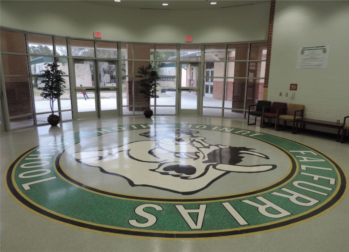 A circular logo on the floor of a building that says calfornia 's