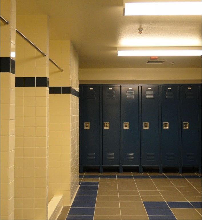 A row of blue lockers in a locker room