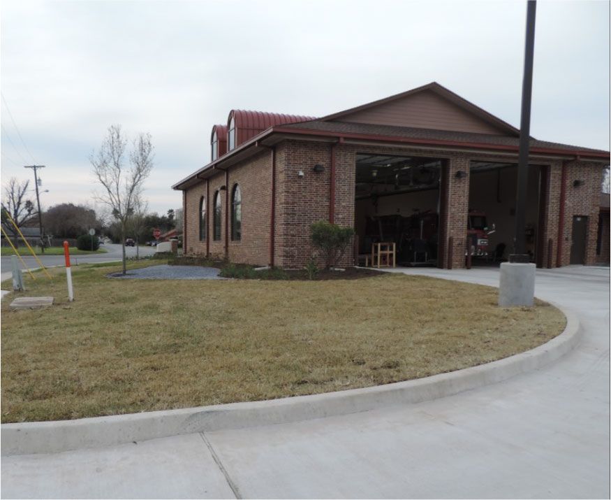 A large brick building with a red roof