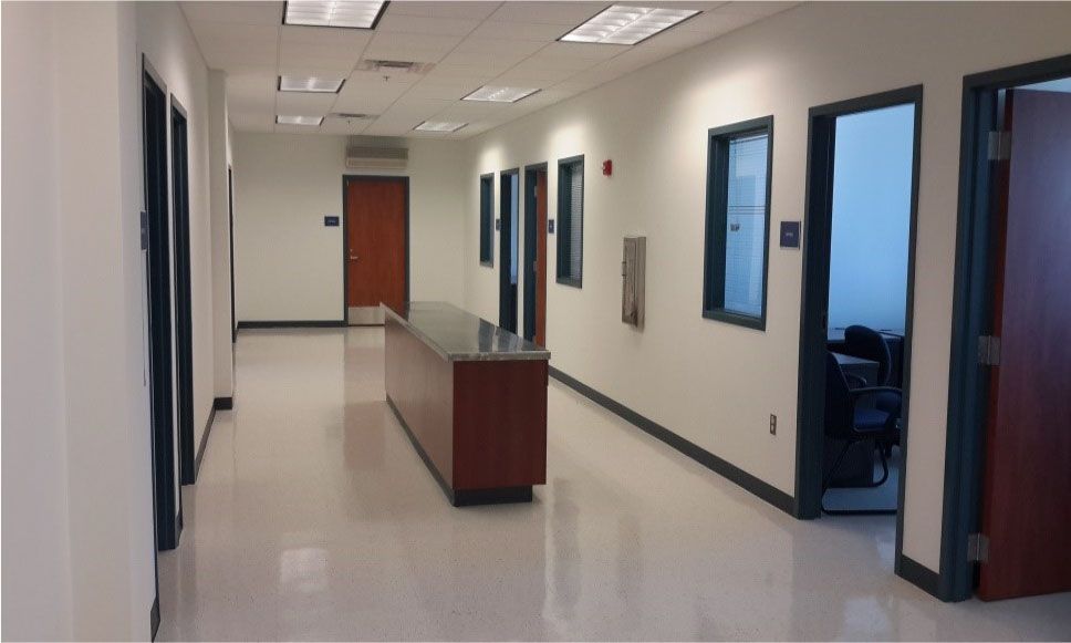 A long hallway with a counter in the middle