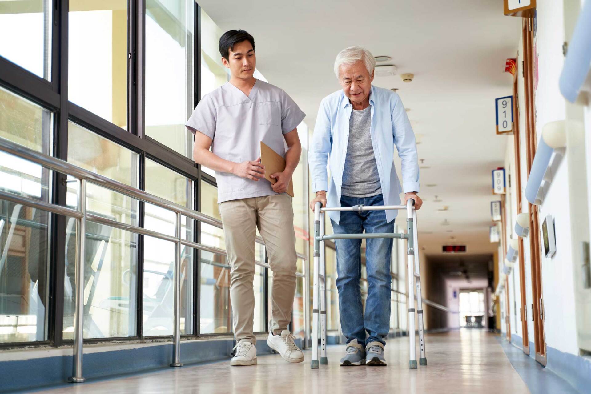 Nurse and a Senior Man Walking Using a Walker — West Palm Beach, FL — Right Care Solutions